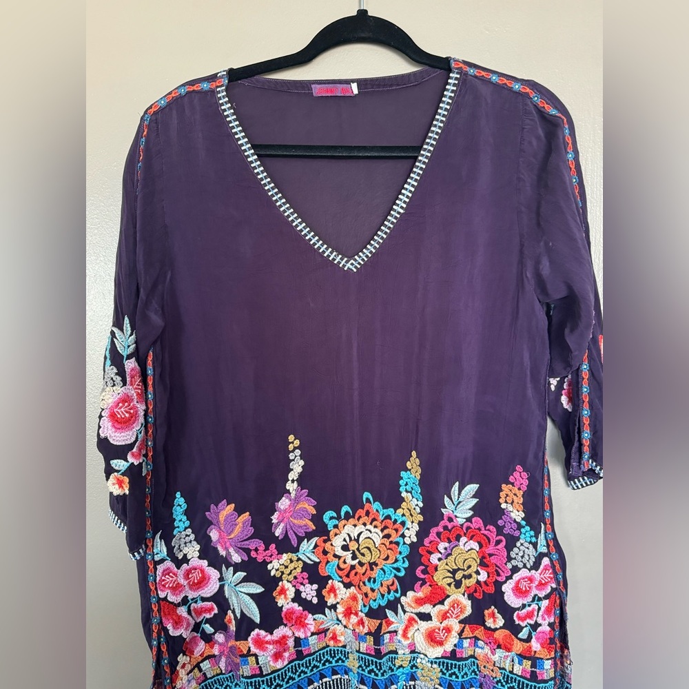 Johnny was. Purple embroidered blouse.